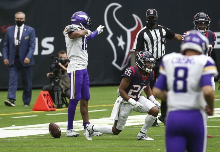 Oct 4, 2020; Houston, Texas, USA; Minnesota Vikings wide receiver Justin Jefferson (18) signals after making a reception against the Houston Texans for a first down during the second quarter at NRG Stadium.